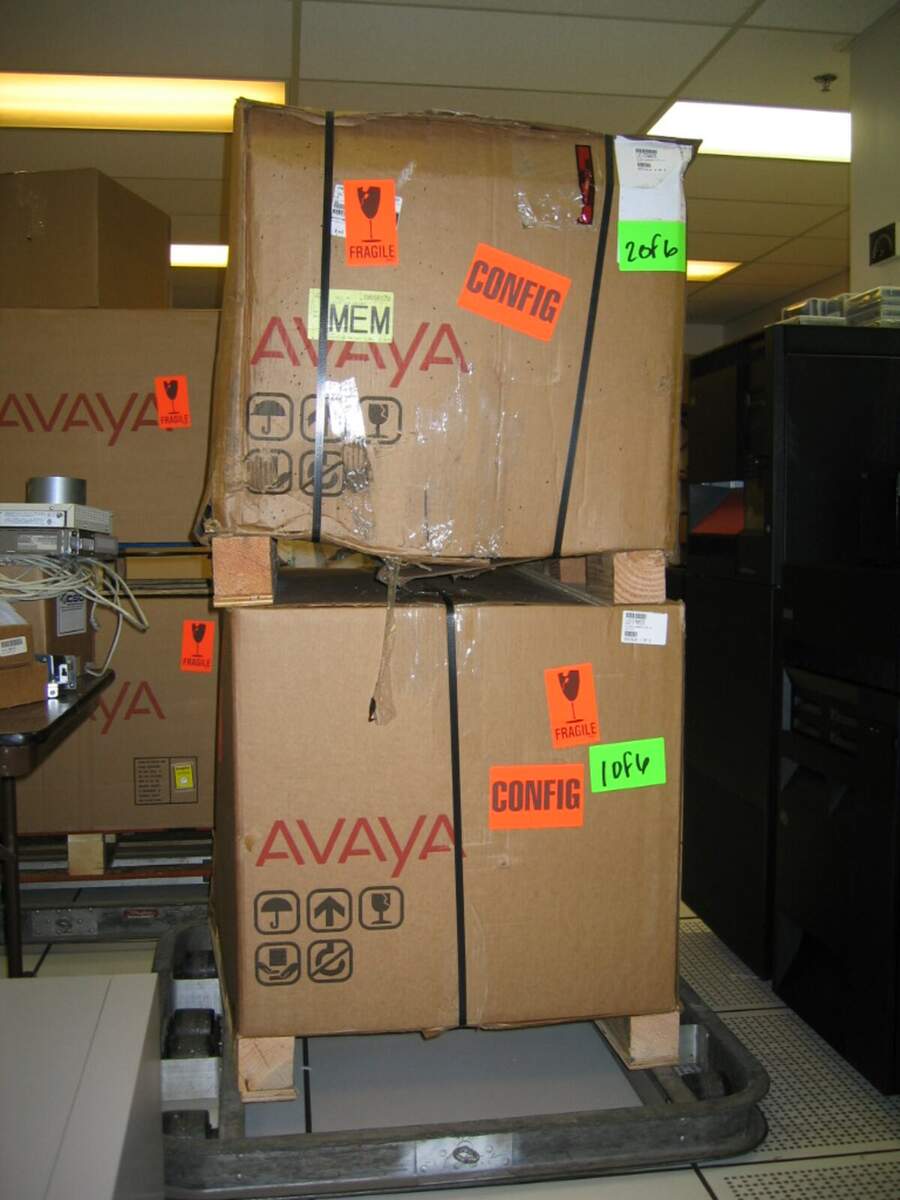 Boxed Avaya phone system equipment delivered to a data center for installation